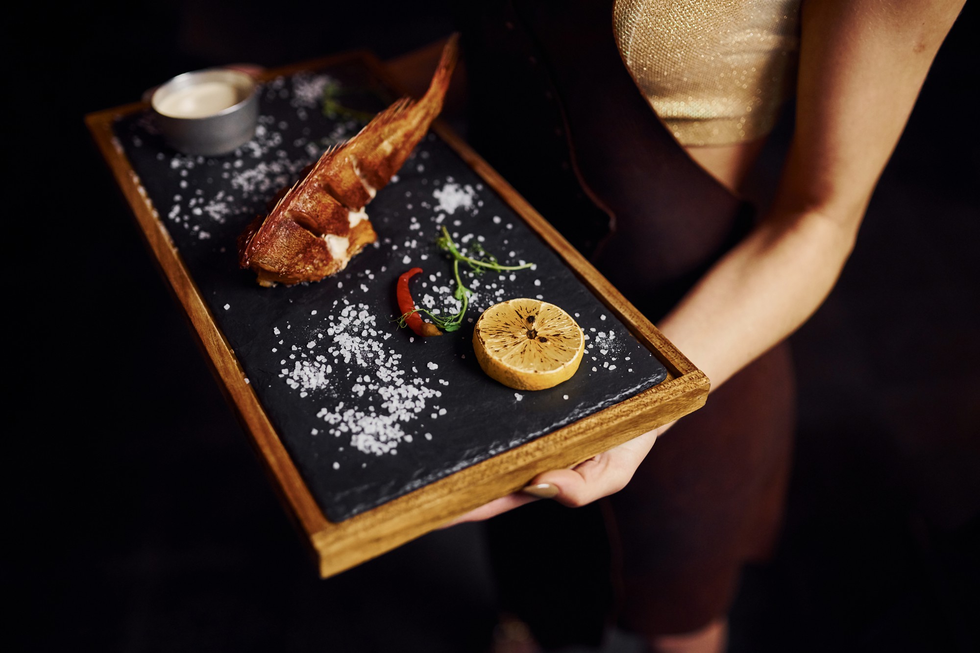 Set of plated tasting portions on black slate