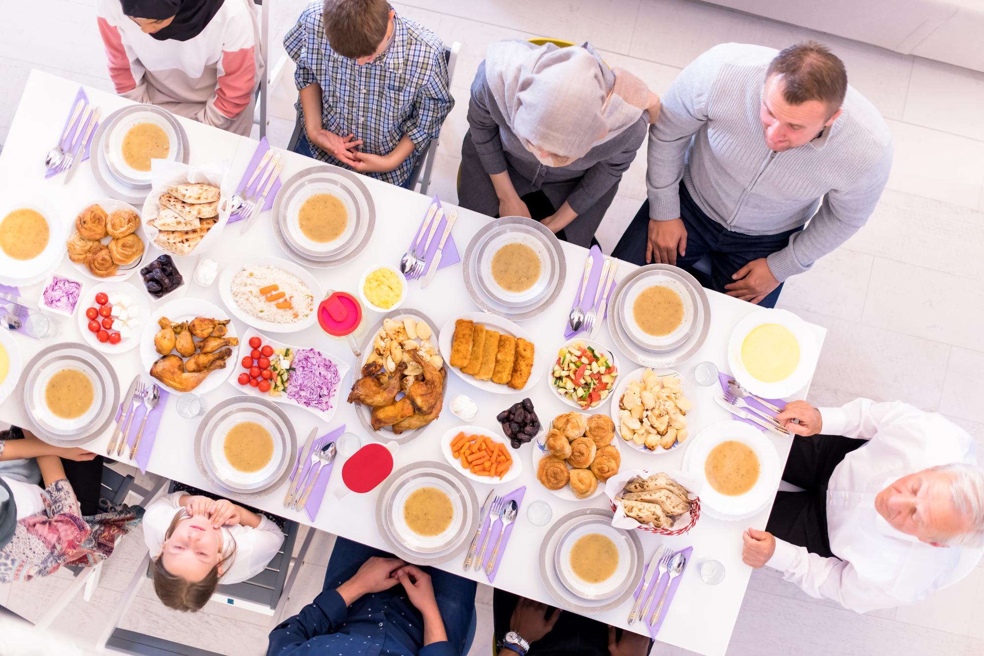 Team cooking workshop around a large table